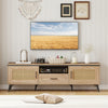 Mid Century Modern entertainment center in oak with faux rattan, featuring 2 cabinets, a drawer, and sturdy metal legs.