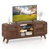 Mid Century Modern entertainment center in walnut with grille-style sliding doors, perfect for living room media.