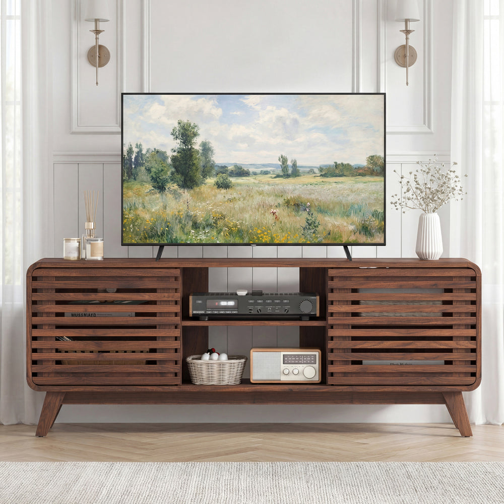 Mid Century Modern entertainment center in walnut showcasing grille-style sliding doors and a spacious top for decor.