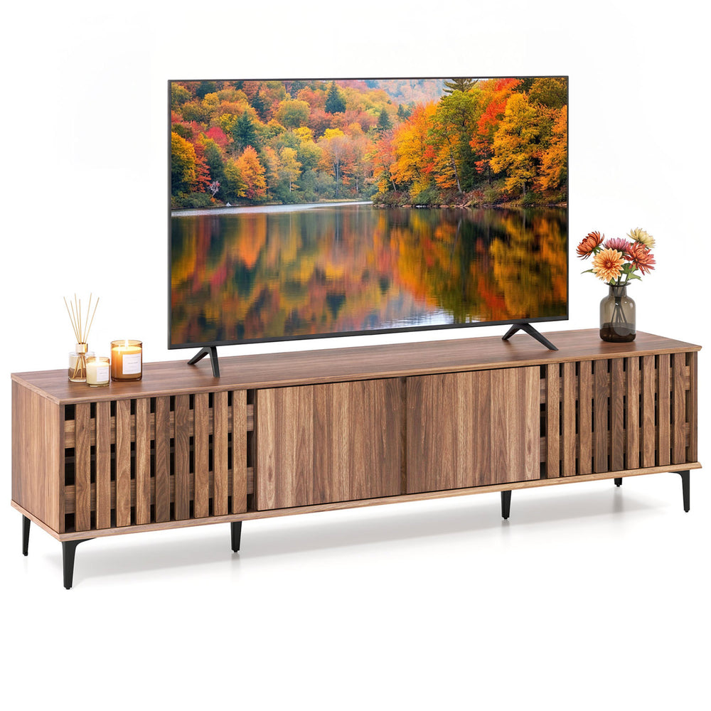 Mid-century modern entertainment center in walnut with slatted doors and four storage cabinets for living room.