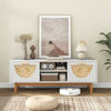 Mid Century Modern TV stand with bamboo woven fronts, featuring 2 drawers and open shelves for electronics, styled in.
