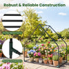 Mini greenhouse with a sturdy metal frame, waterproof bottom mat, and vibrant flowers, ideal for outdoor gardening.