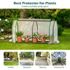 Mini greenhouse with roll-up zipper door, 47.5 x 21.5 x 24 inches, ideal for garden protection and stability.