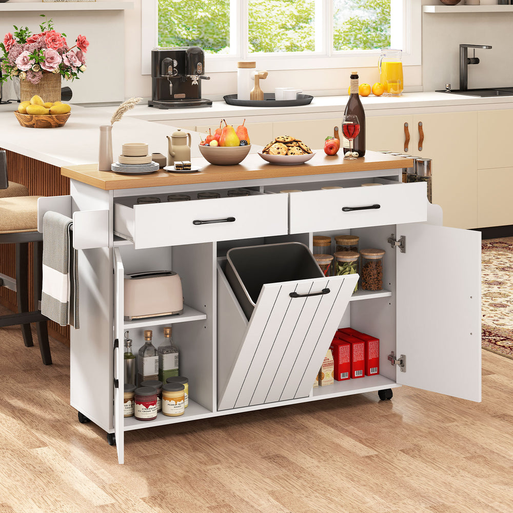 Mobile kitchen island table in white with trash bag storage, adjustable shelves, and a spacious prep area for dining.