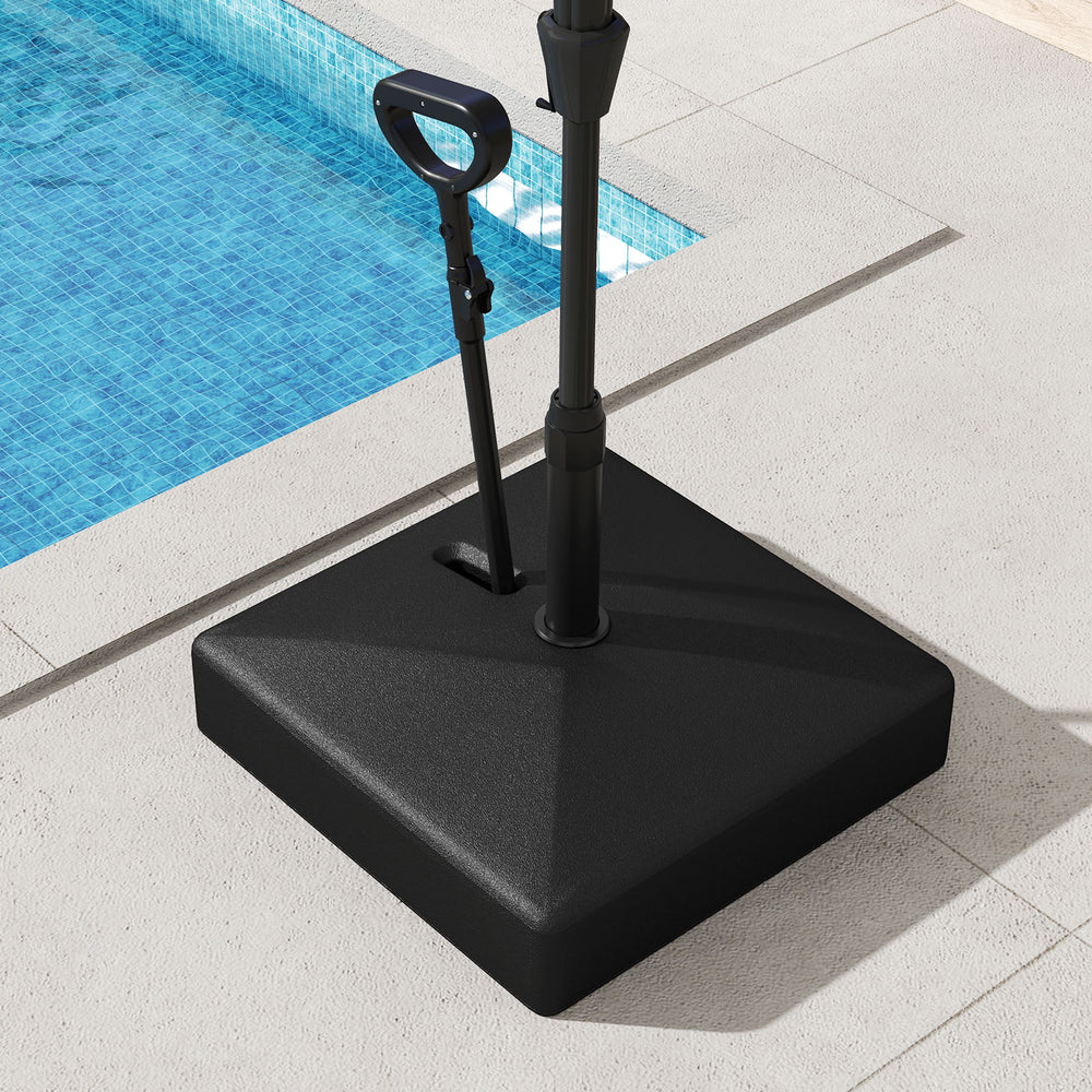 Mobile patio umbrella base in black, featuring wheels for easy movement and a fillable reservoir for stability.