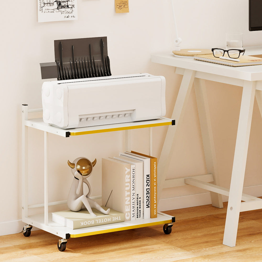 Mobile side table with golden trimmed edges, featuring 2-tier open shelves and wheels for easy mobility in any room.