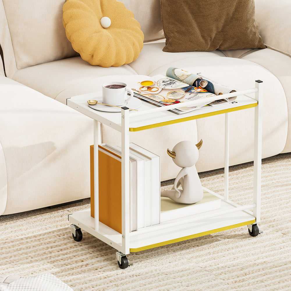 Mobile side table with golden trimmed edges, featuring 2-tier open shelves, ideal for books and decor in modern living.