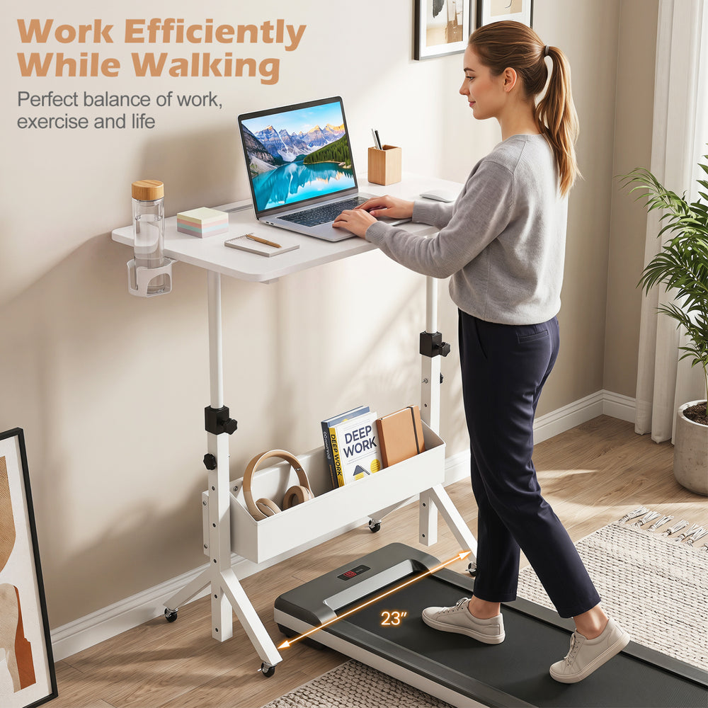 Height adjustable mobile standing desk with treadmill, cup holder, and storage basket for efficient work while walking.
