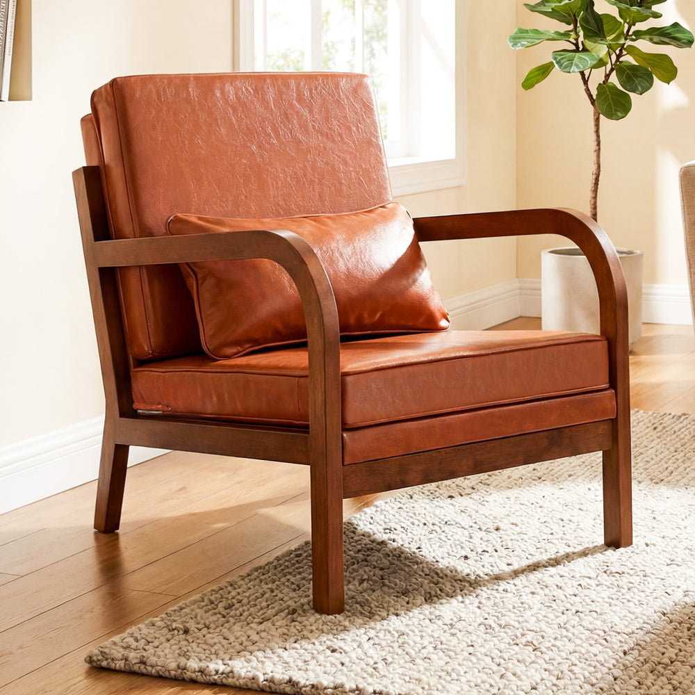 Modern accent chair with brown faux leather upholstery, removable cushions, and sturdy rubber wood frame for cozy.