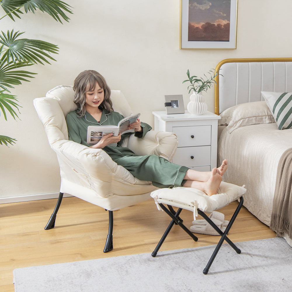 Modern beige accent sofa chair with folding footrest and side pocket, ideal for living room or bedroom relaxation.