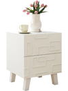Modern white nightstand with 3D geometric patterns, featuring two spacious drawers, perfect for bedside essentials.