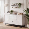 Modern buffet sideboard cabinet in white with a roomy tabletop, perfect for displaying decor or serving drinks in style.