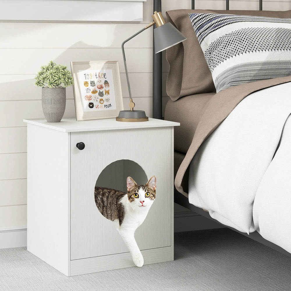 Modern cat litter box enclosure in white with a cat emerging from the side, perfect for discreet pet care.