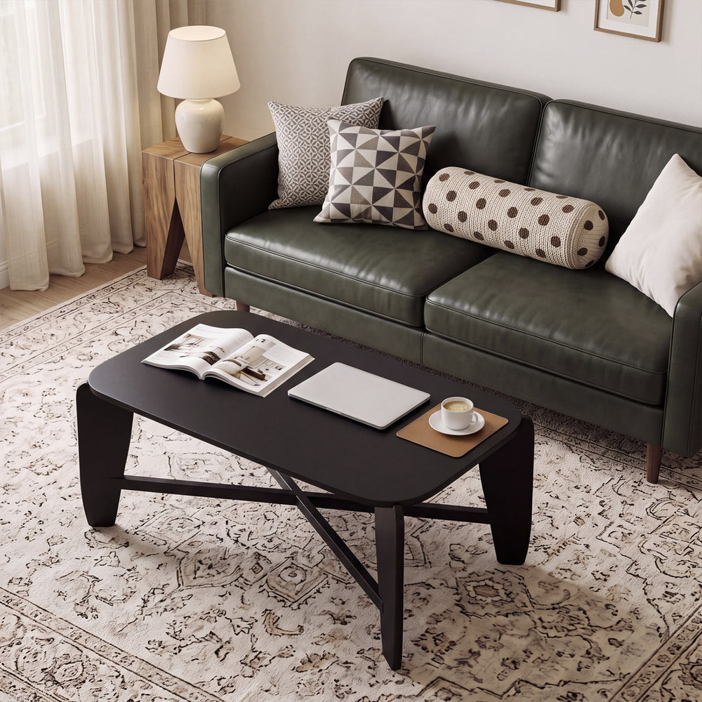 Modern black coffee table with rubber wood cross-leg base, featuring a wide tabletop for storage and stylish design.
