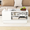 Modern coffee table in white with 2-tier open storage shelves, featuring a spacious tabletop and clean lines for a.