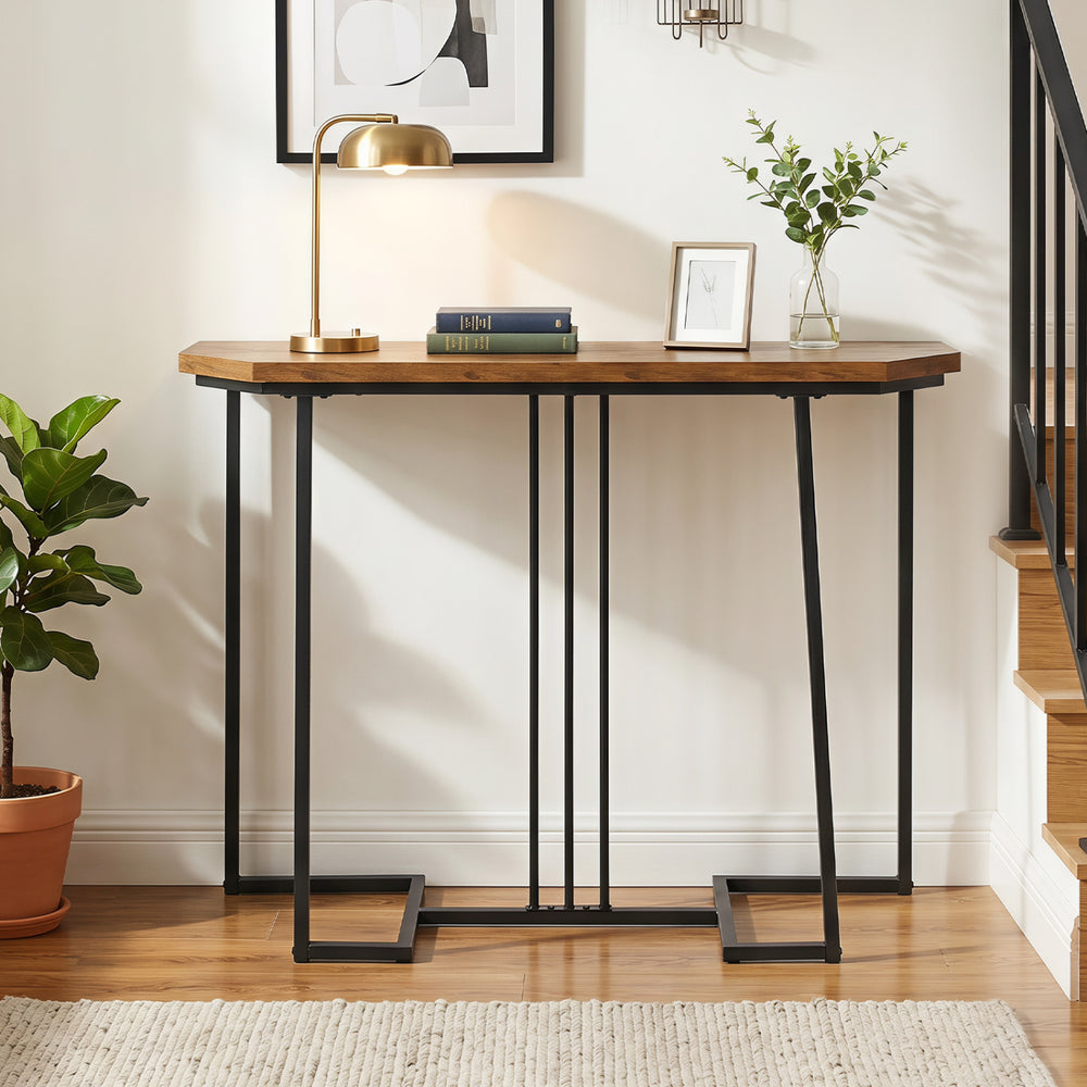Narrow rustic brown console table with metal legs, featuring a water-resistant surface and geometric design for entryways.
