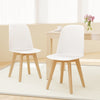 Set of 2 modern dining chairs with white PP seats and solid beech wood legs, perfect for dining or living spaces.