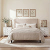 Modern farmhouse 3-drawer nightstand in white with wood grain accents, perfect for bedside storage and decor.