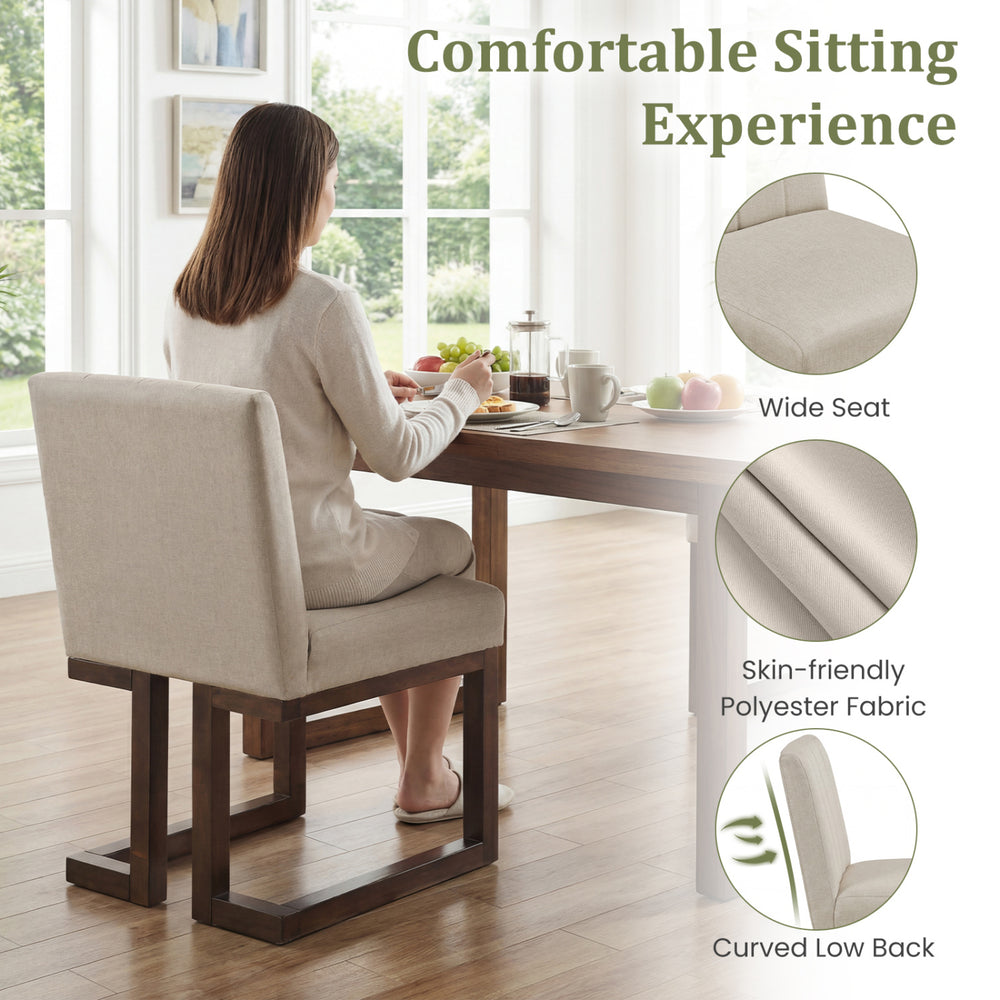Modern farmhouse dining chair with thick padded seat and curved low back, upholstered in breathable polyester fabric.