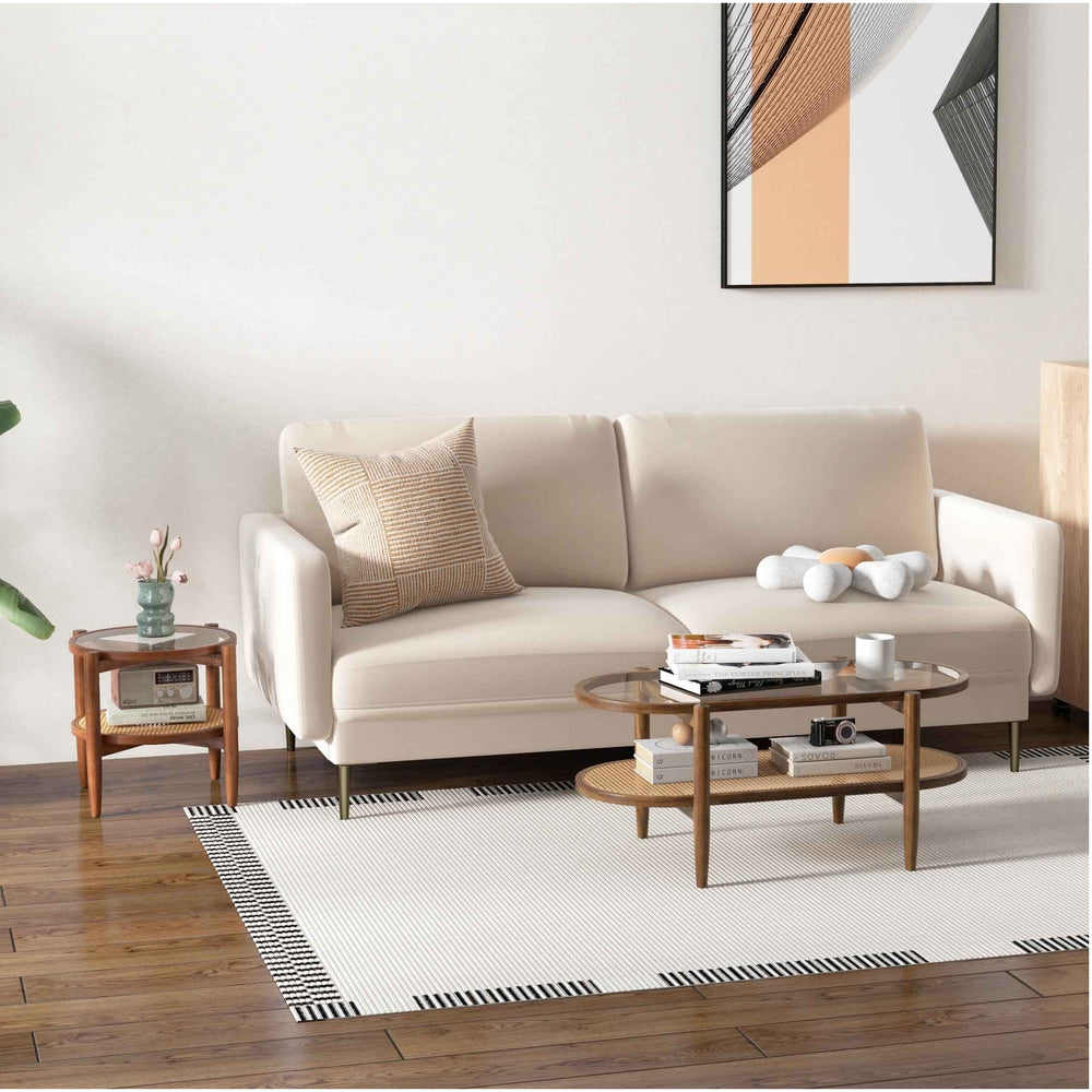 Modern two-seater sofa with cozy armchair and round side table, perfect for stylish living room decor and relaxation.