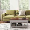 Lift top coffee table with white base and wood top, styled with a green sectional sofa for a modern living room.