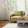 L-shaped modular sectional sofa in green with lift top coffee table and stylish 3-globe floor lamp for modern living.