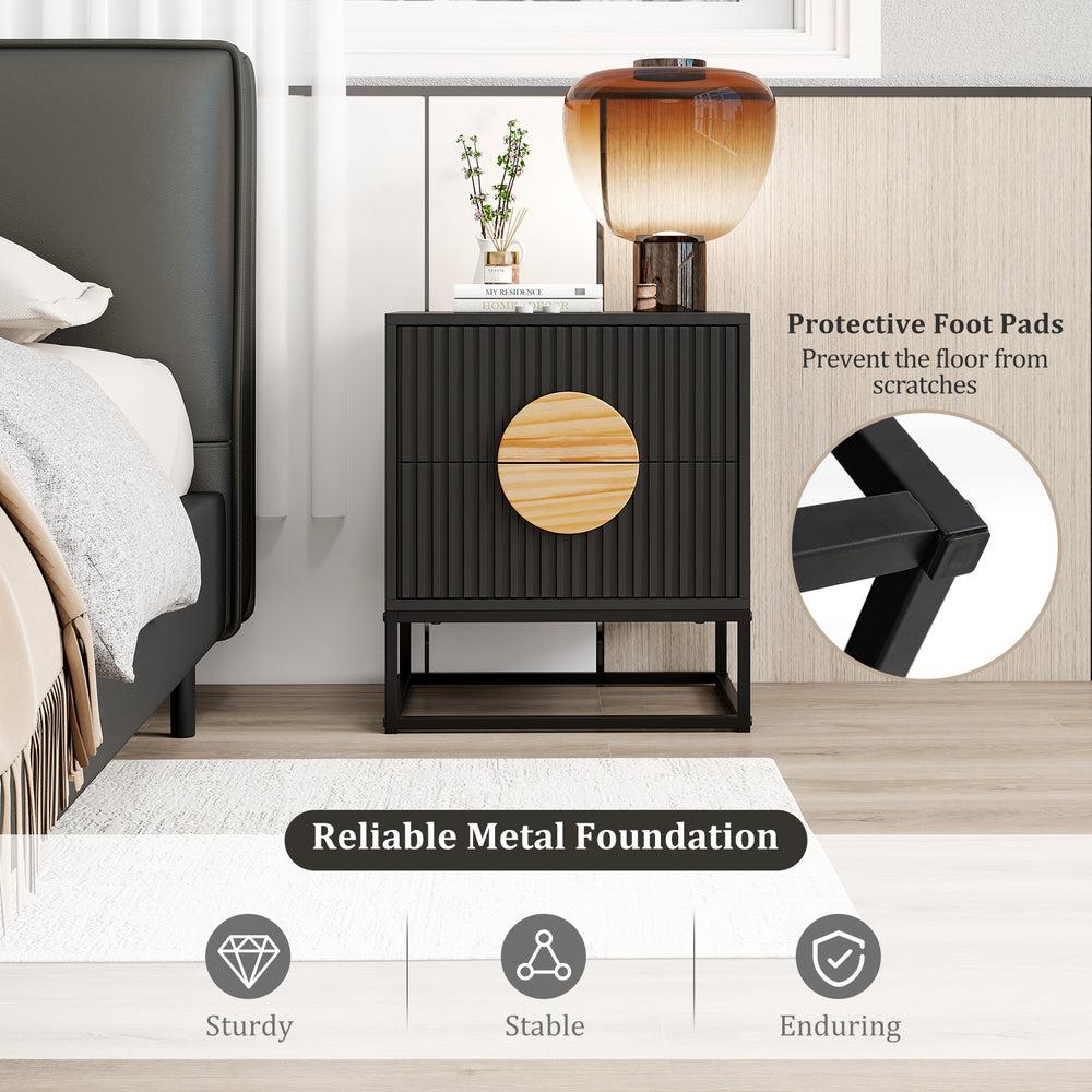 Close-up view of the modern black nightstand's fluted texture and solid pine wood handles, showcasing its stylish.