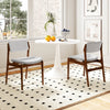 Modern padded dining chairs with rubber wood legs, featuring gray linen fabric and a stylish farmhouse design for.