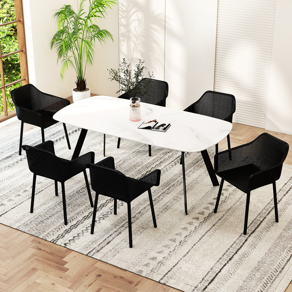 Black dining chairs set of 4 with breathable mesh backrest, placed around a modern white dining table for stylish.