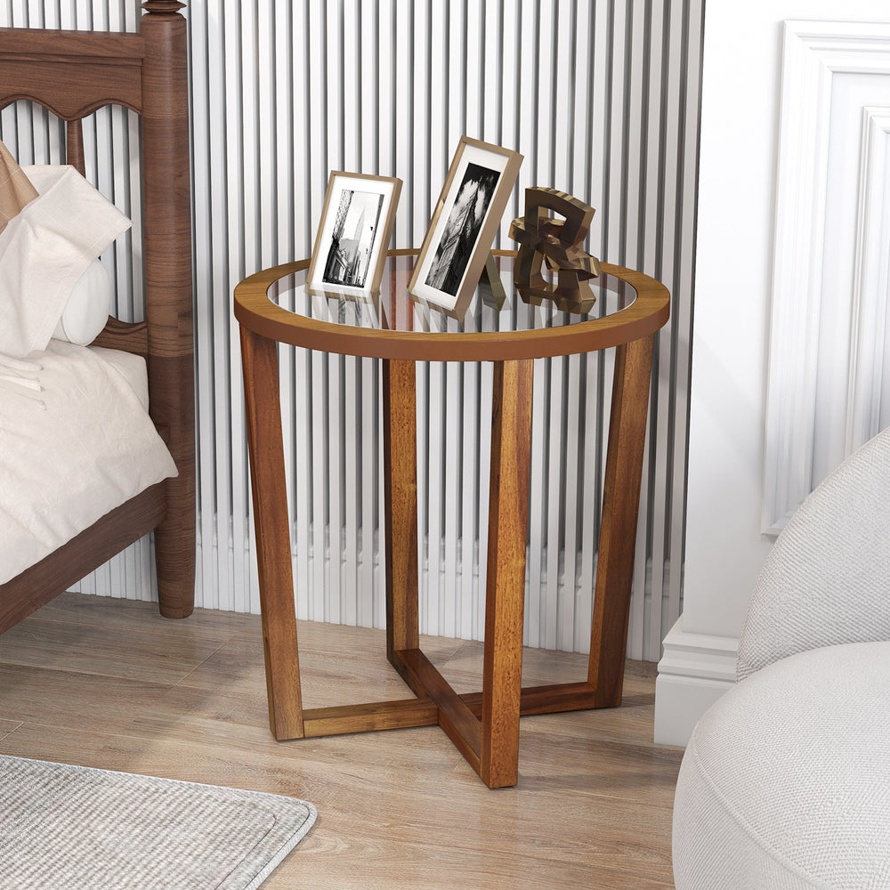 Round end table with a transparent tempered glass top and solid acacia wood legs, perfect for decorative items.