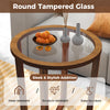 Round end table with transparent tempered glass top and solid acacia wood legs, perfect for decorative items.