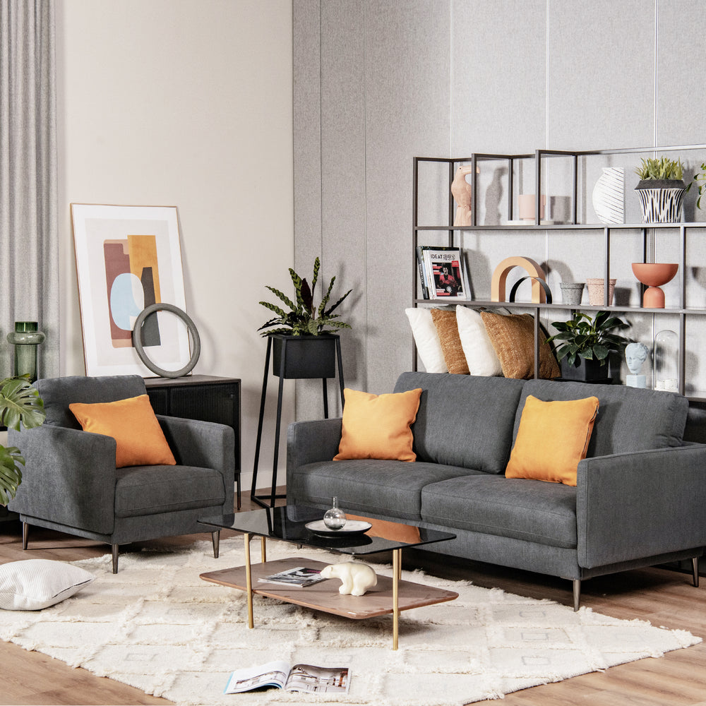 Gray modern armchair with solid metal legs and removable backrest cushion, adding stylish comfort to any living space.