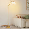 Modern standing lamp with pleated lampshade and adjustable head, perfect for living room or bedroom lighting.