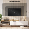 Modern TV stand for TVs up to 80 inches, featuring storage shelves and cabinets, shown in a stylish living room setting.