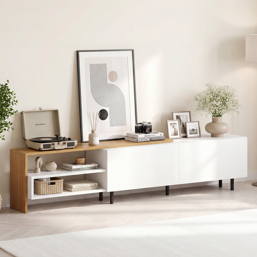 Modern white TV stand with storage shelves and cabinets, designed for 80-inch TVs, styled in a contemporary living room.