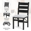 Modern black folding chair with ergonomic backrest and cushioned seat, ideal for dining rooms and gatherings.