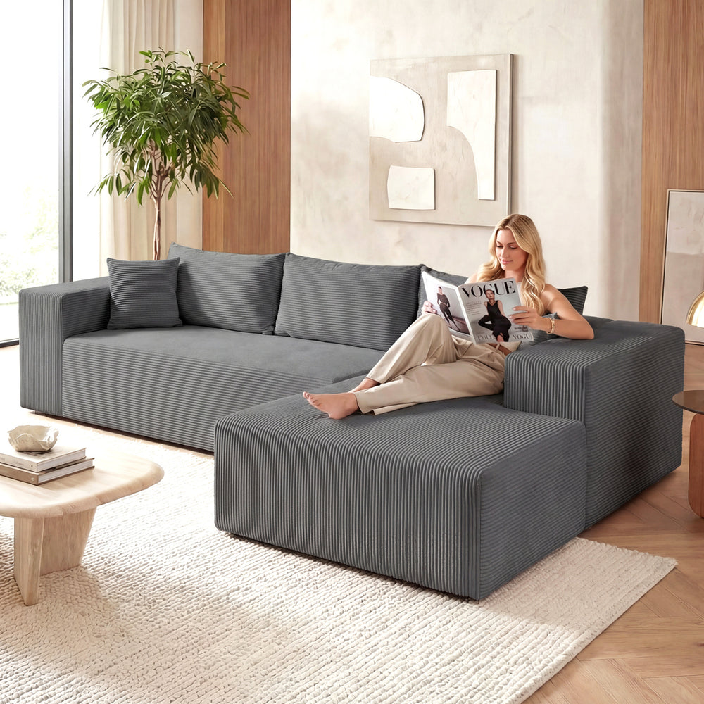 Modular gray sectional sofa with deep seats and a sleek design, perfect for stylish and comfortable living room seating.