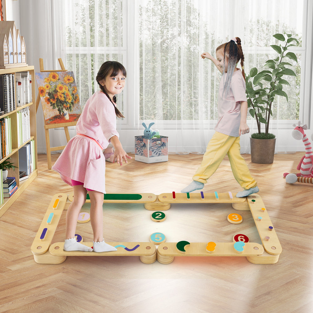 Montessori balance beam set with wooden stepping stones, promoting motor skills and imaginative play for kids indoors.