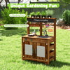 Mud kitchen made of natural fir wood with 4 planting pots, removable sink, and blackboard for kids' gardening fun.