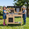 Kids play with the Mud Kitchen Playset featuring removable sinks, stoves, and a water box for outdoor fun.