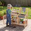 Mud kitchen playset with sink, plant cups, and stainless steel kitchenware for outdoor fun and gardening activities.