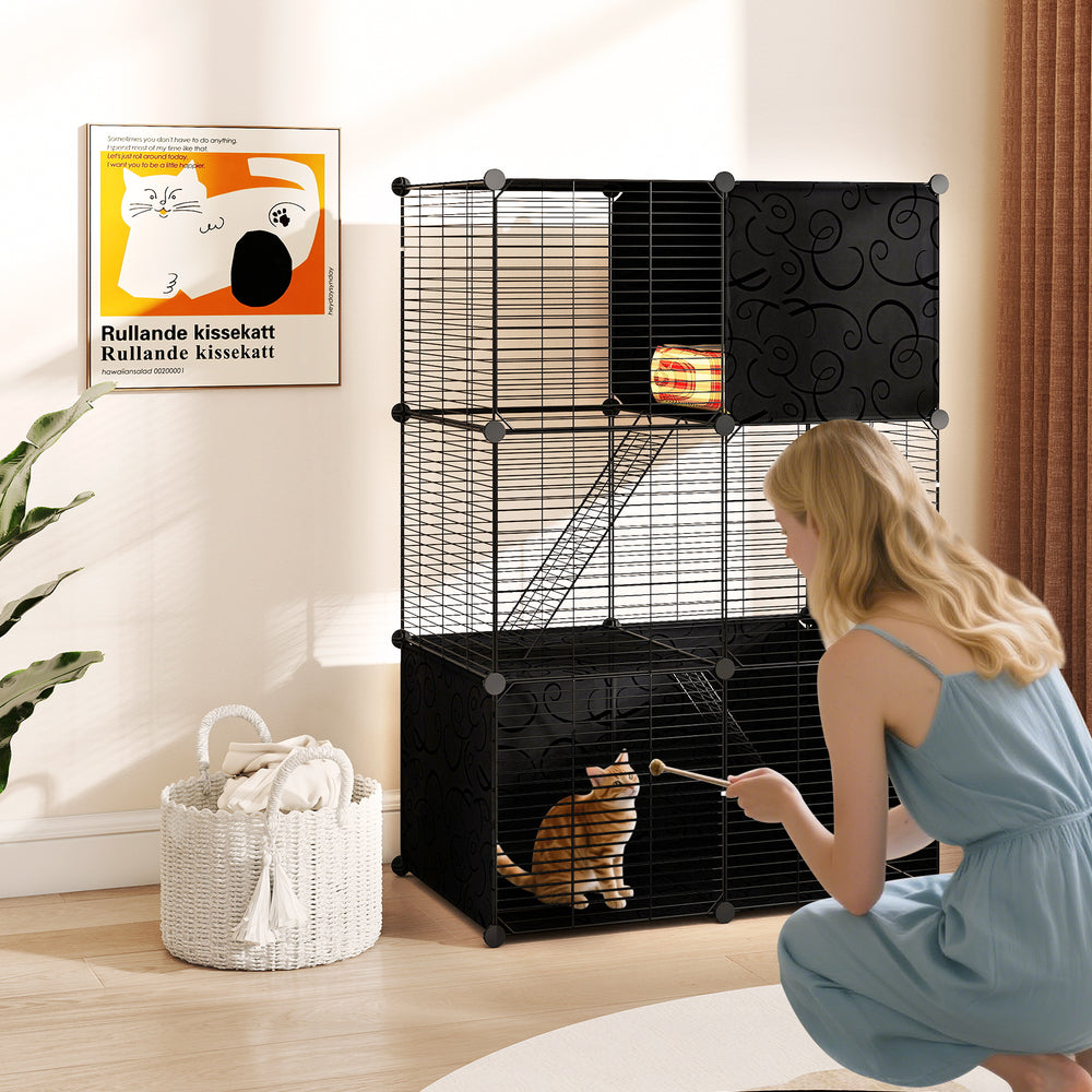 Multi-level cat tower in black featuring a 2-door condo, hammock, and climbing platforms for playful exploration.