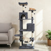 Multi-level dark gray cat tower showcasing a soft hammock and wide platforms for lounging and playful exploration.