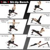 Multifunctional sit-up bench in use, showcasing adjustable positions for versatile workouts and comfortable padding.