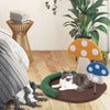 Mushroom cat bed with sisal scratch panel and playful ball, perfect for resting and claw grinding in any room.
