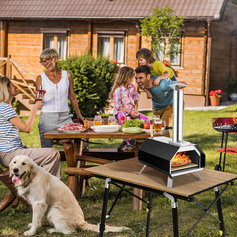 Outdoor pizza oven with foldable legs, cooking a pizza outdoors, ideal for camping and quick meals.