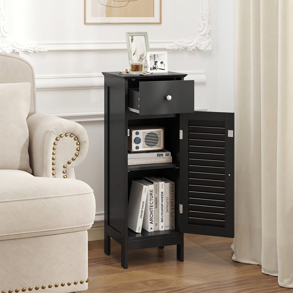 Narrow black bathroom storage cabinet featuring a drawer, adjustable shelf, and louvered door for space-saving organization.