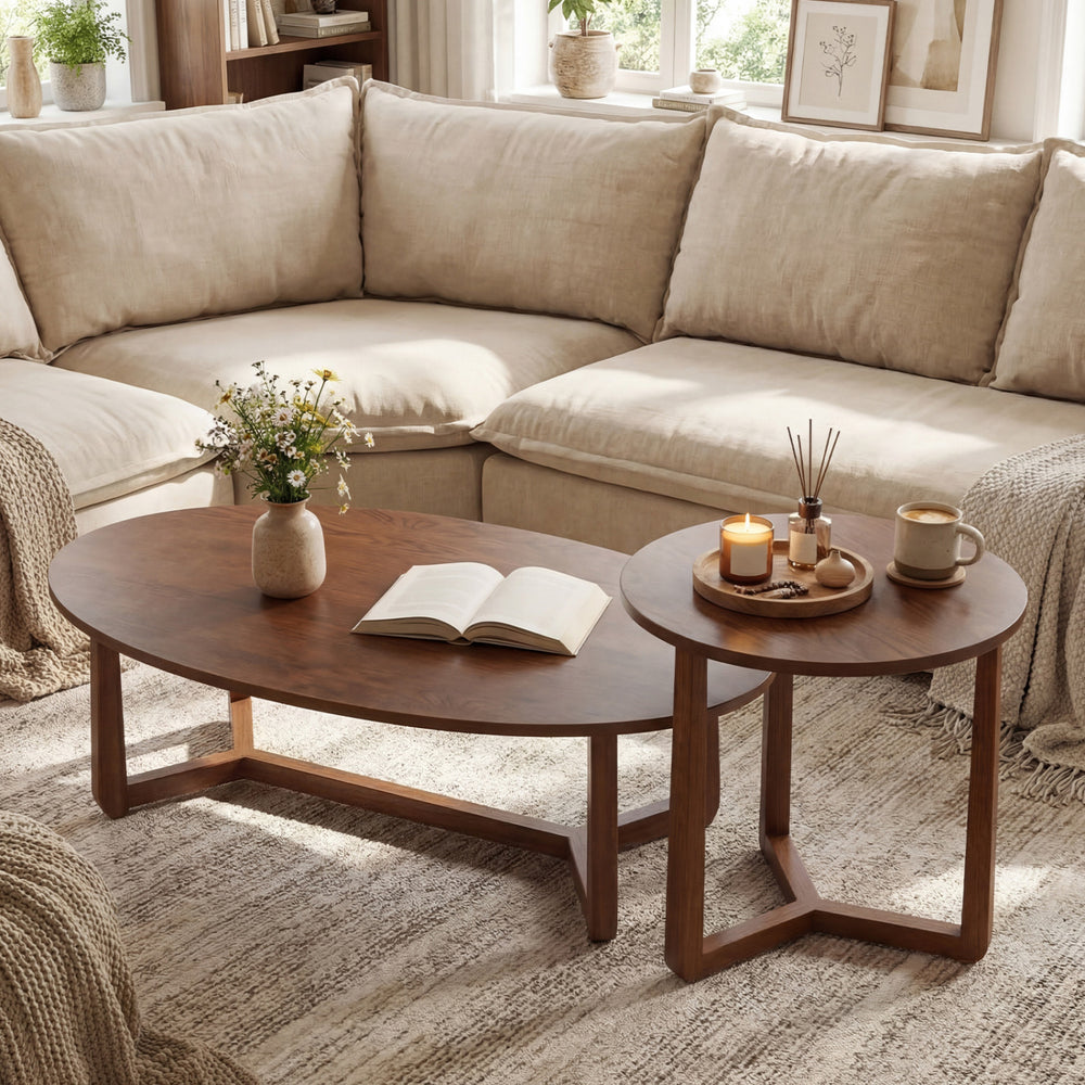Nesting coffee table set of 2 in walnut with solid rubberwood legs, featuring oval and round tops for versatile use.