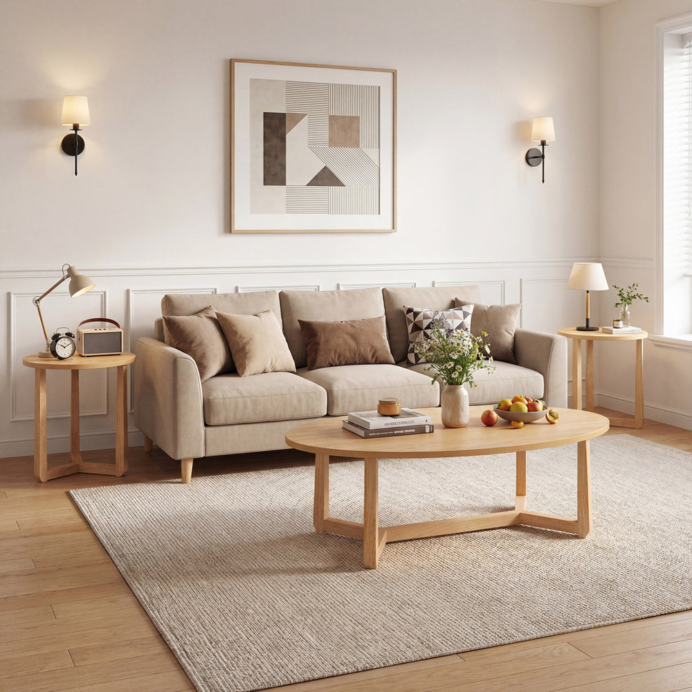 Oval nesting coffee table with a wood veneered top and solid rubberwood legs, designed for versatile living room use.
