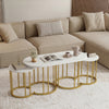 Close-up view of the nesting coffee table set showcasing the elegant faux marble finish and sturdy gold metal frame.